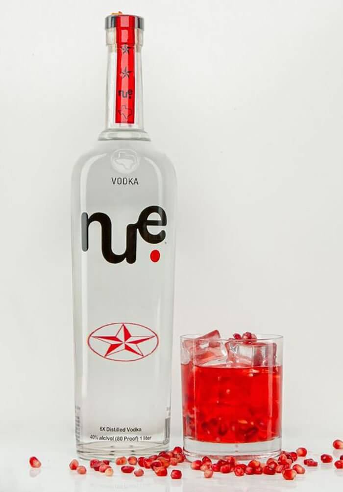 NUE Pomegranate Spritz, bottle and cocktail on white
