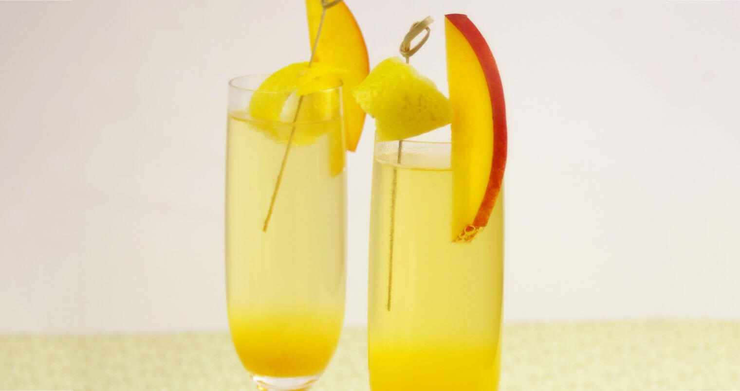 Peach Ginger Bellini, champagne cocktails, mango garnish, featured image