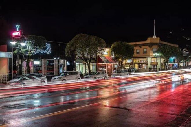 Peri's Bar, night skyline, busy road