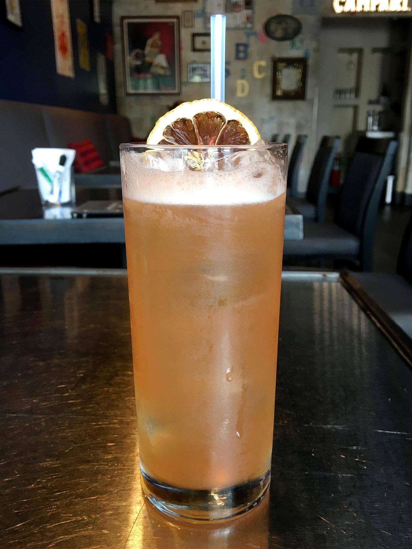 pew pew cocktail in glass with garnish