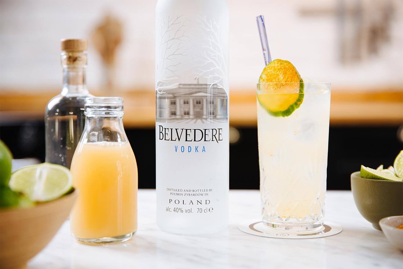 Belvedere Pomme Highball, kitchen display with bottle, garnishes and cocktail