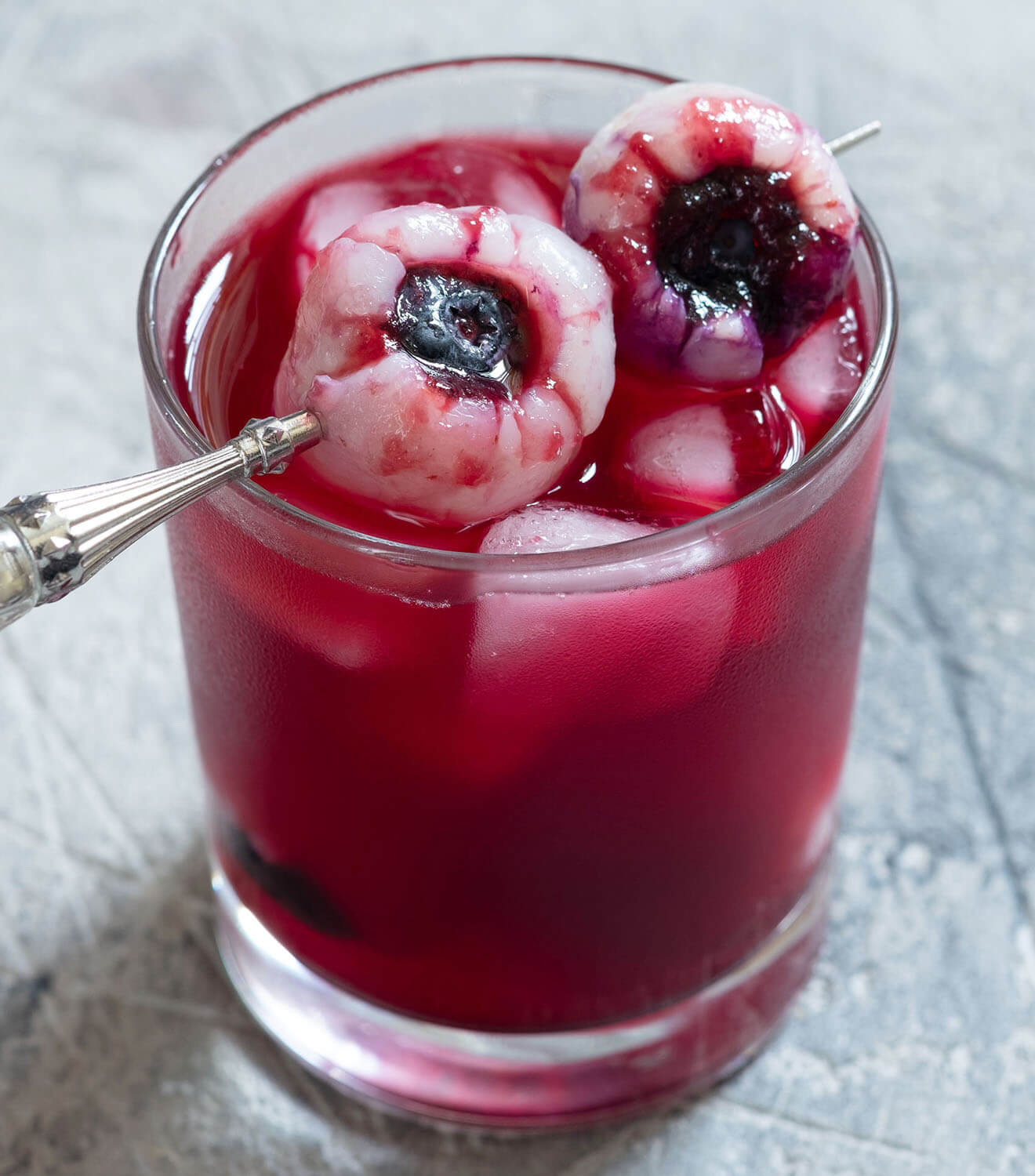Poolside Lounge, pink with berry garnish toothpick