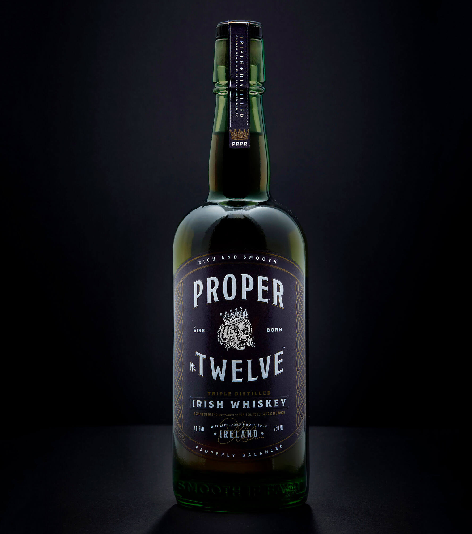 Proper No. Twelve Irish Whiskey, bottle on dark background
