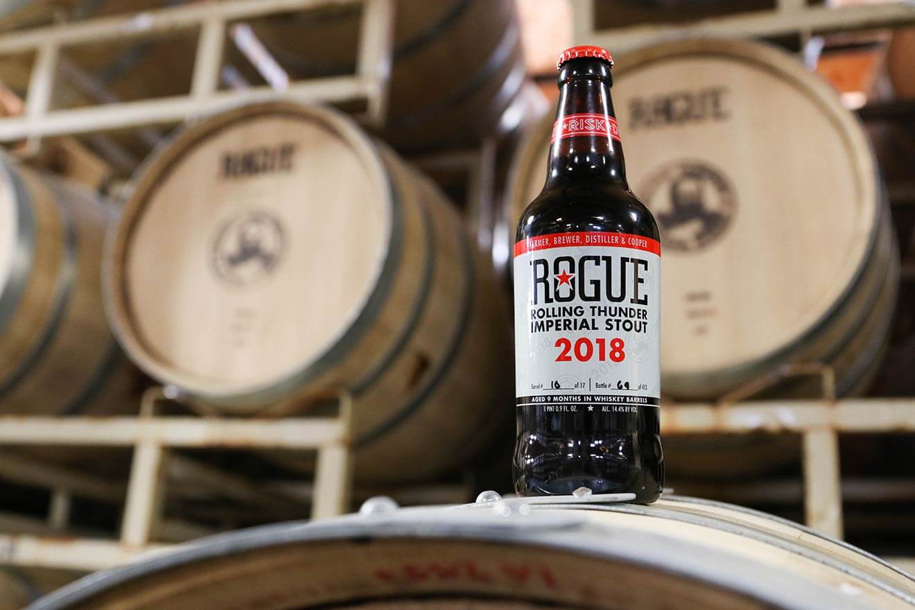 Rolling Thunder Imperial Stout 2018, bottle on barrel, barrel background