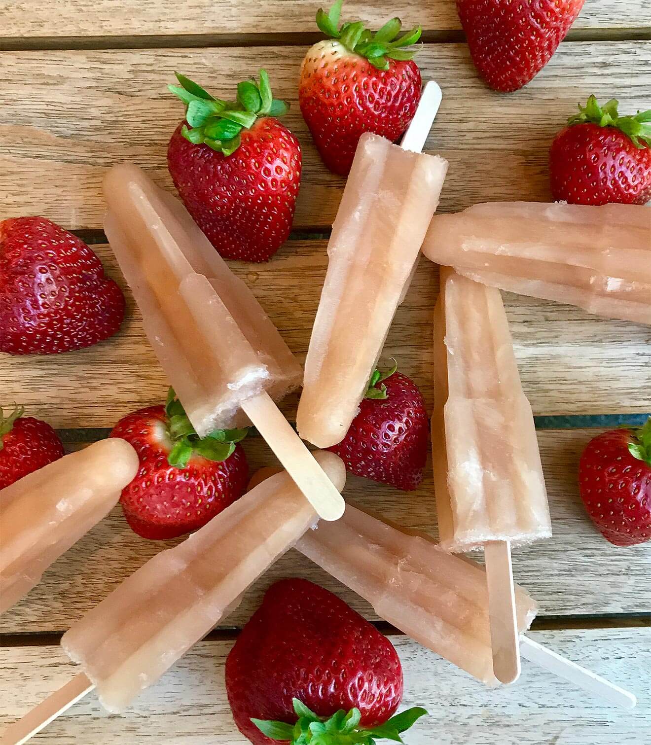 Rosé Popsicles and strawberries