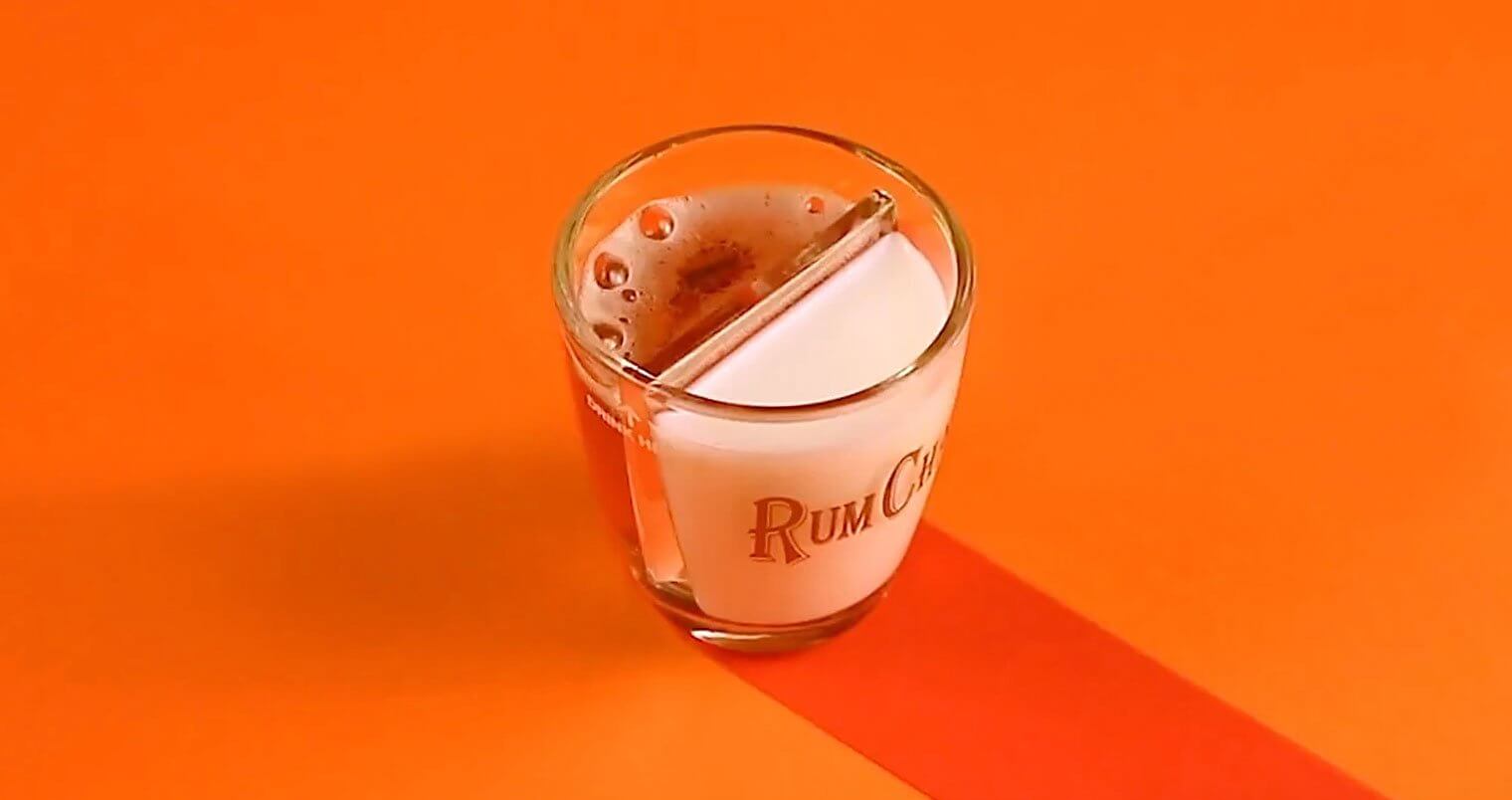 Chilled Drink of the Week: RumChata Pumpkin Bomb, cocktail on orange background