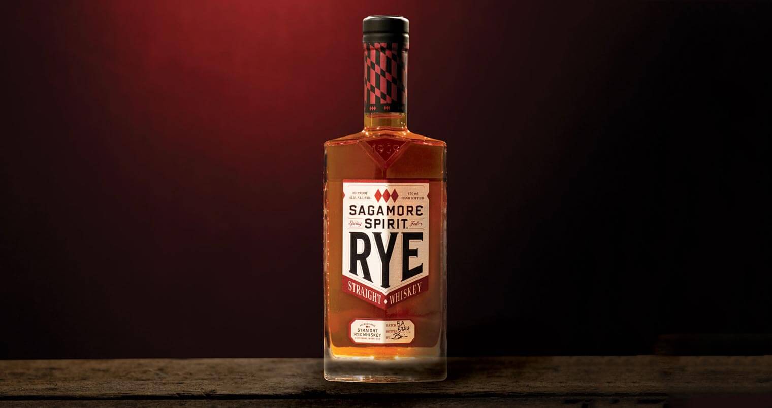 Sagamore Spirit Rye Whiskey, bottle on dark red back, featured image