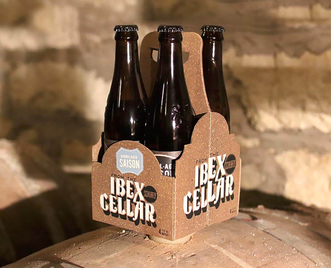 Schlafly Beer Releases Barrel-Aged Saison, 6 pack of bottles on barrel