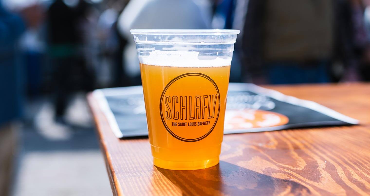 Schlafly, beer in plastic cup on table, featured image