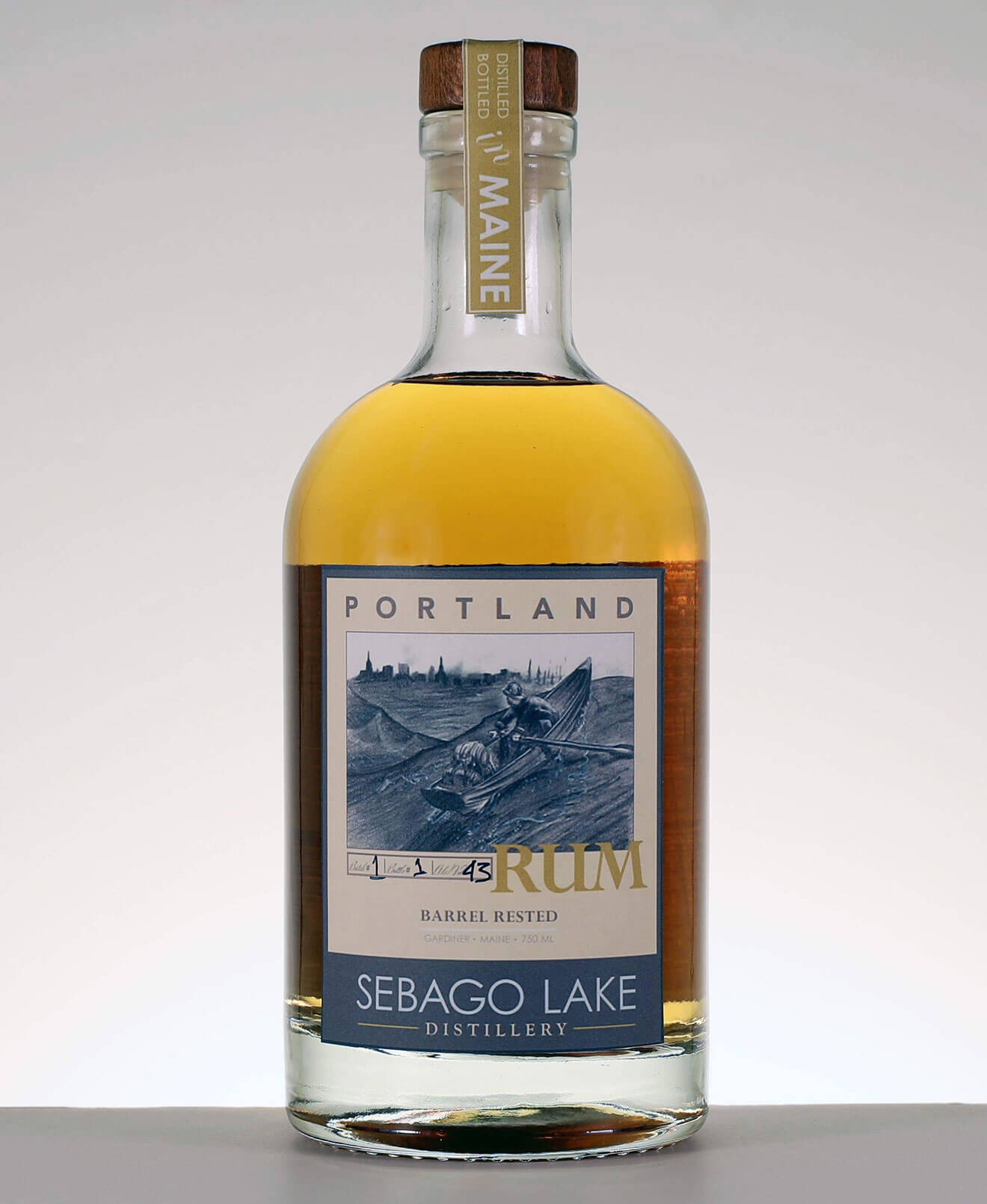 Barrel Rested Portland Rum, bottle on grey background