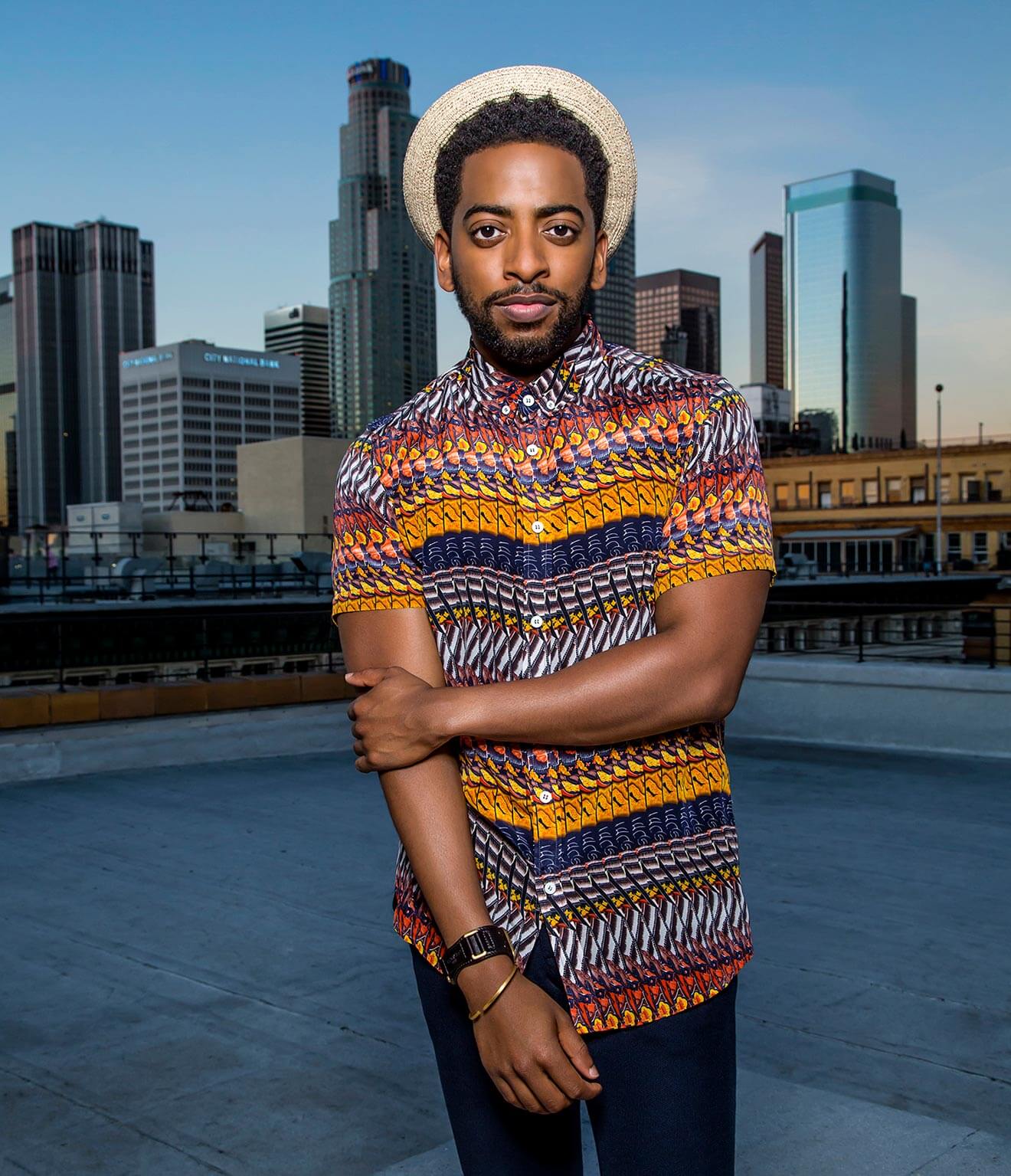chillin with shaun brown, colorful sweater, city backdrop