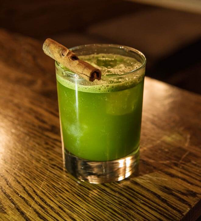 She-lei-lei cocktail with garnish on wooden table