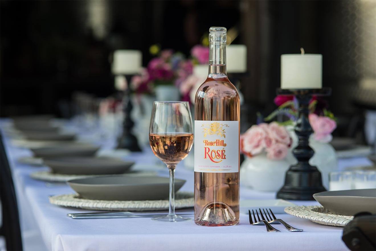 Shinn-Estate-Vineyard-bottle-and-glass-on-dining-table