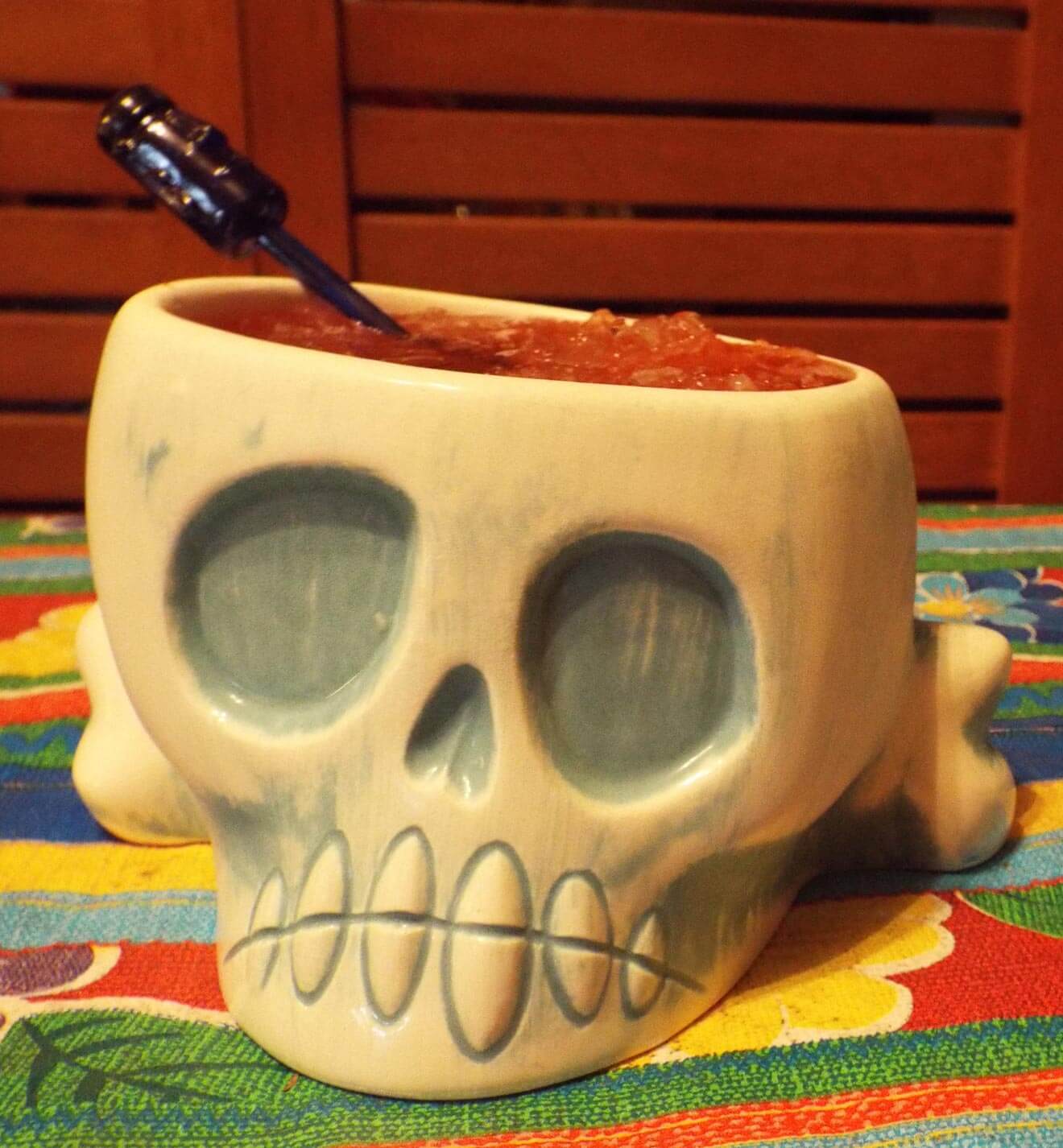 Cocktail in a shrunken skull for tiki party decor