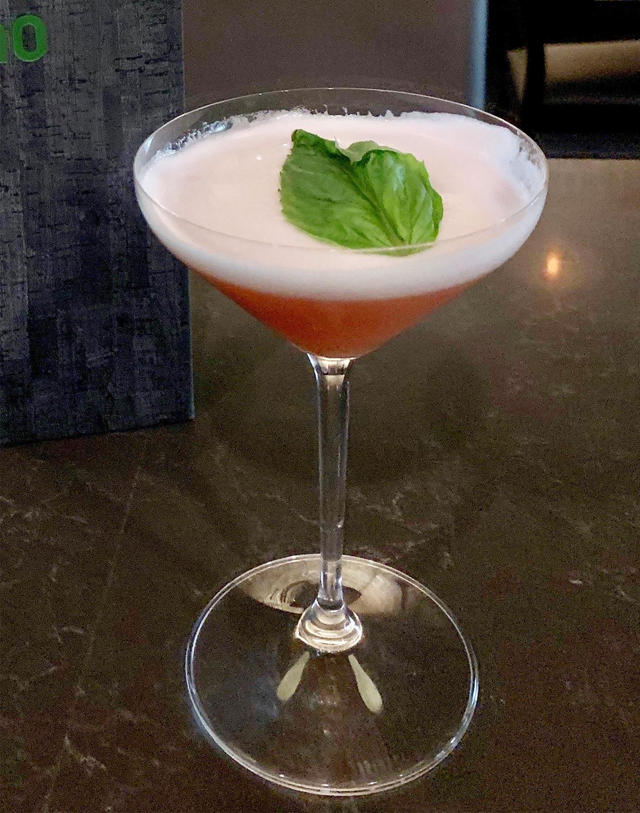 NUE Sip of Liberty cocktail with leaf garnish