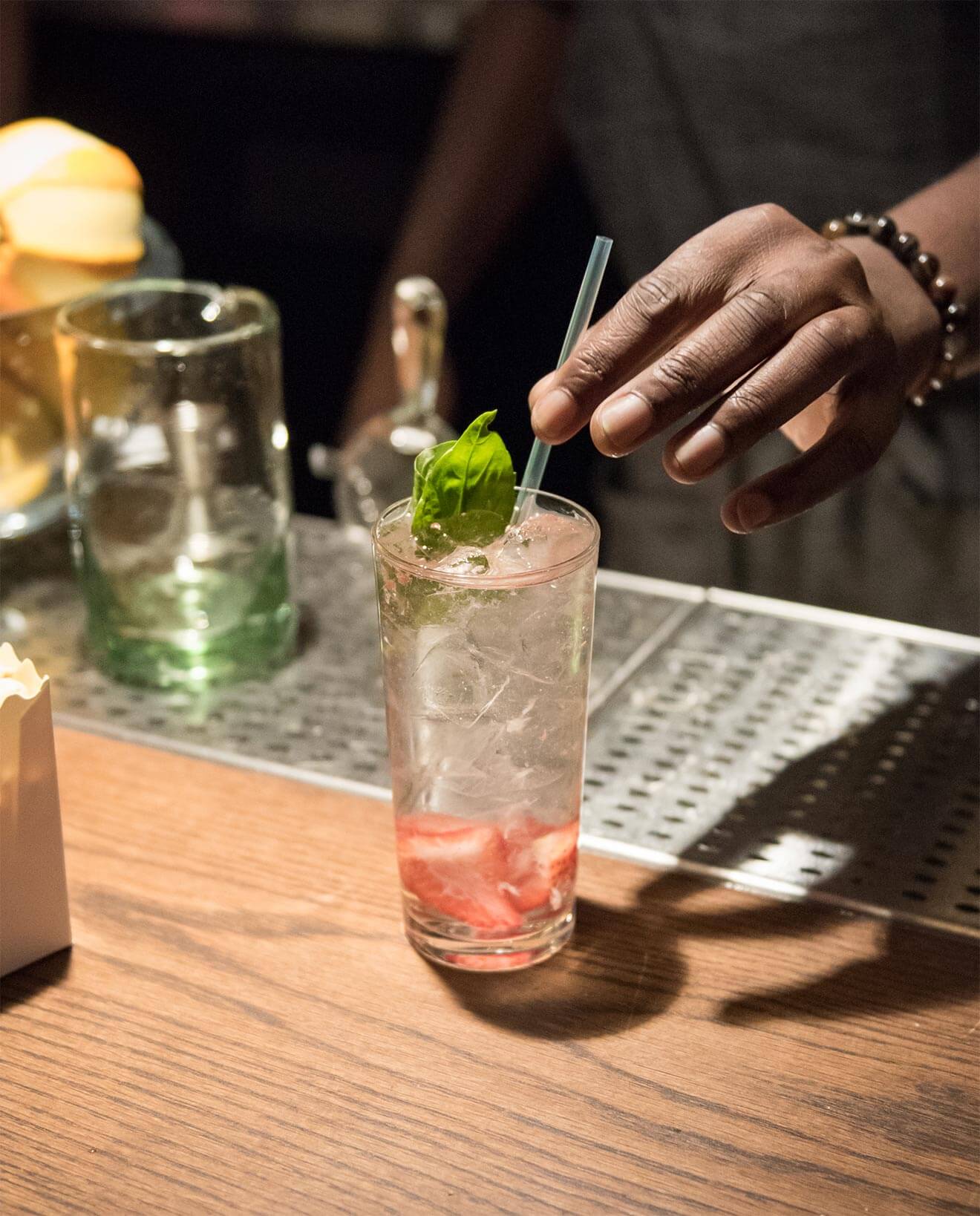 Skinny Rabbit cocktail being mixed and garnished by barman