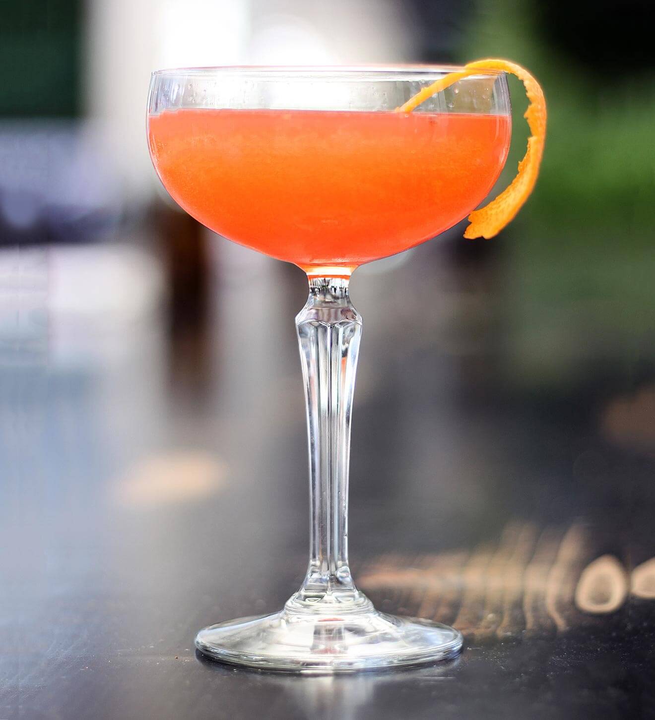 Smoke Show, cocktail with garnish on wooden table