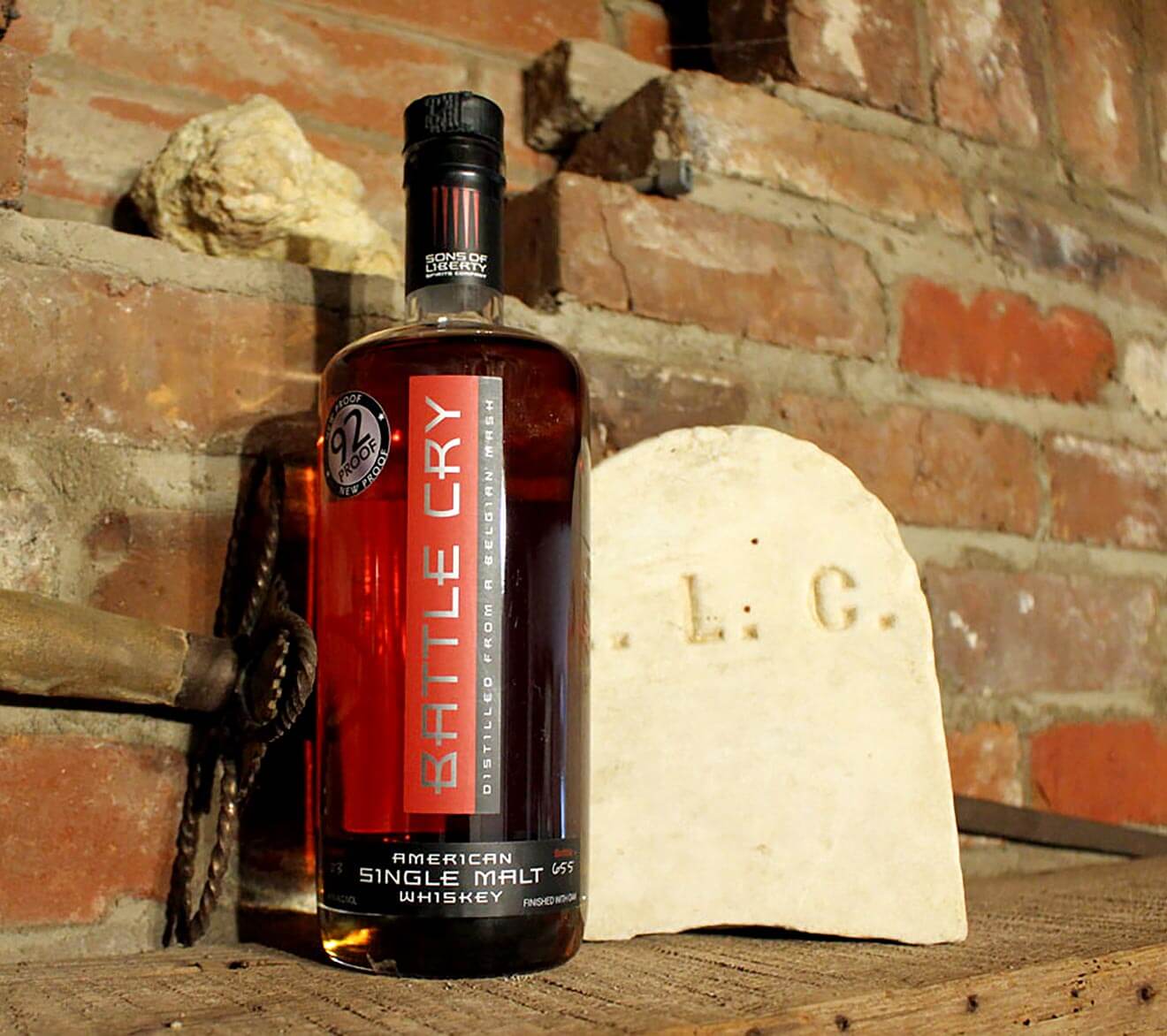 Sons of Liberty Battle Cry Whiskey, bottle on brick wall