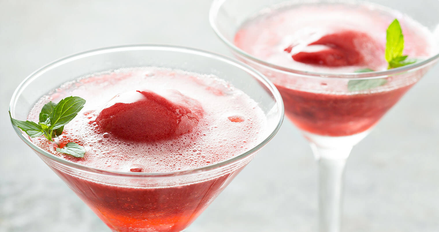 Sparkling rose and raspberry sorbet floats with fresh berries, featured image