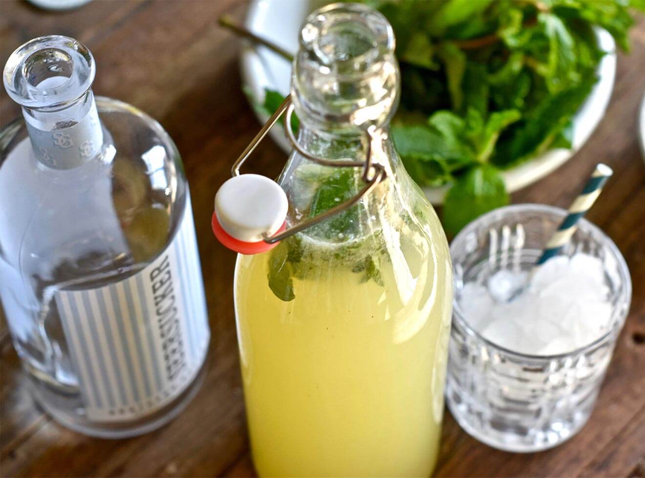 Southside Rickey Bottled Cocktail, bottles and cocktail with garnish on table