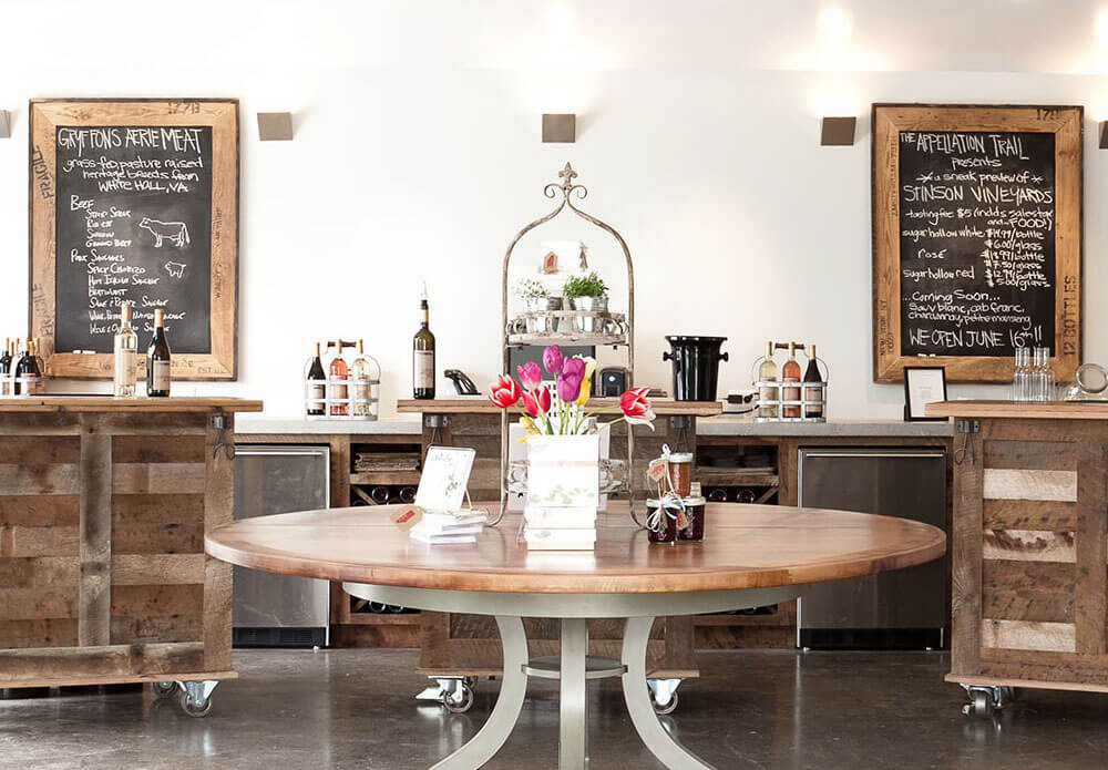 Stinson Vineyards, table with display, chalkboards in background