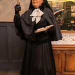 Woman figure with Axe Preaching