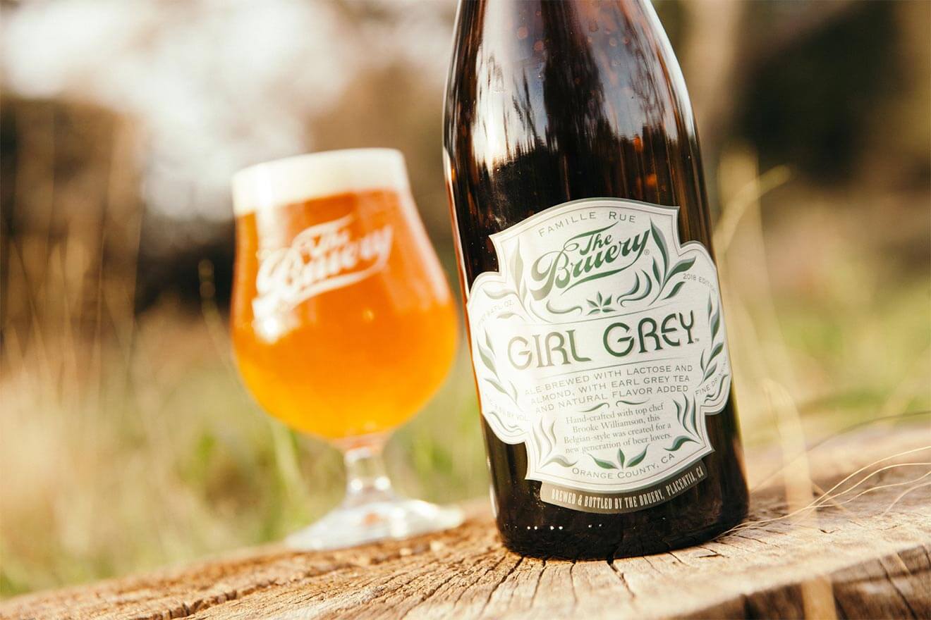 The Bruery Girl Grey Brew, glass and bottle on outside table