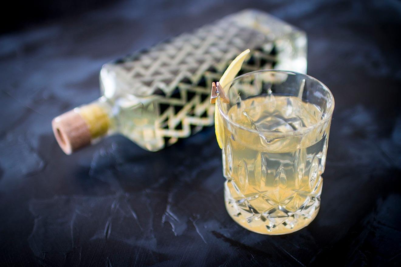 The Chirp, cocktail and bottle on table