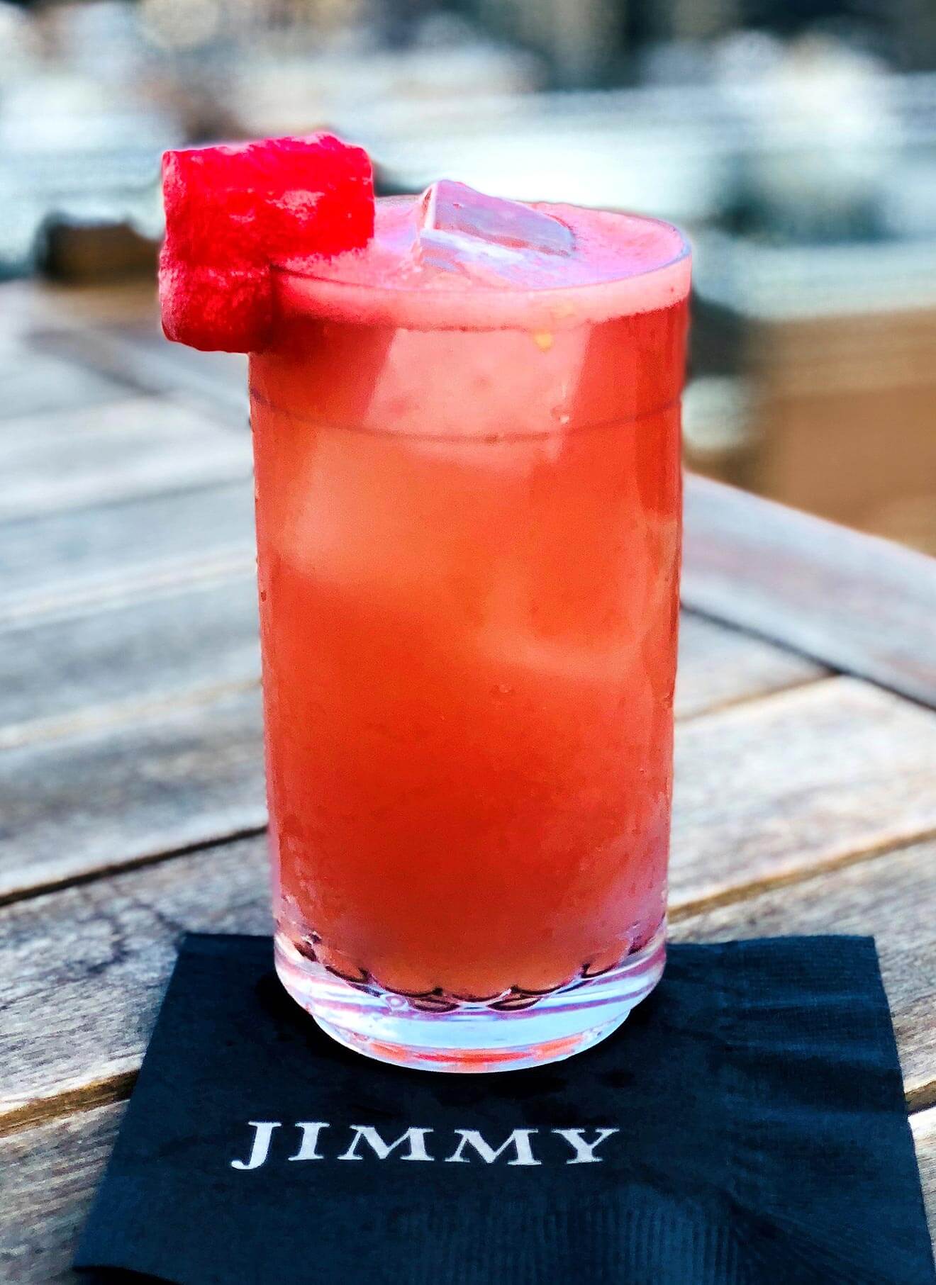 The Gallagher, cocktail on cocktail napkin, watermelon garnish