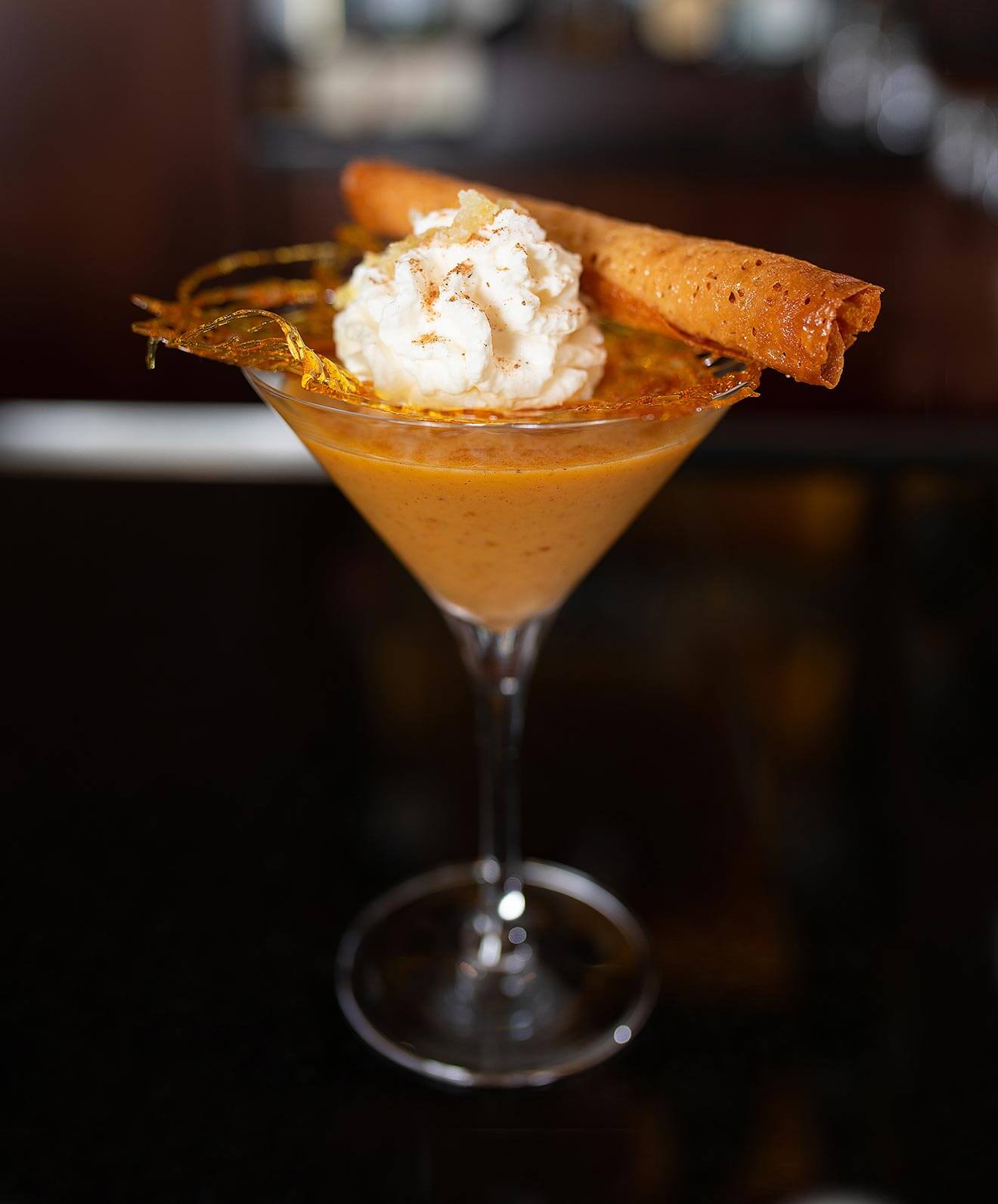 The Great Pocono Pumpkin Spiced Martini, martini cocktailwith garnish and whipped cream