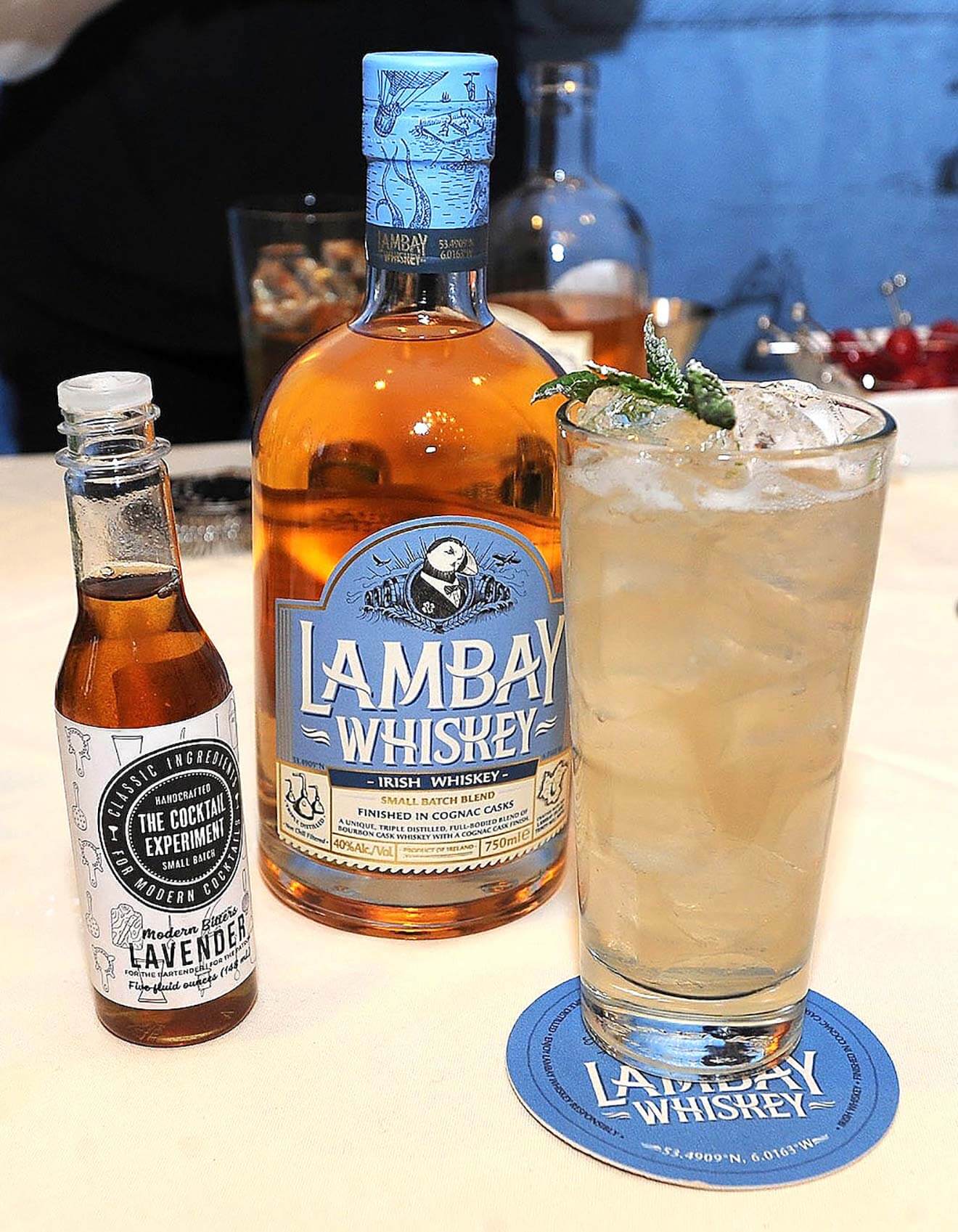 The Lambay Selkie, bottles and cocktail on table