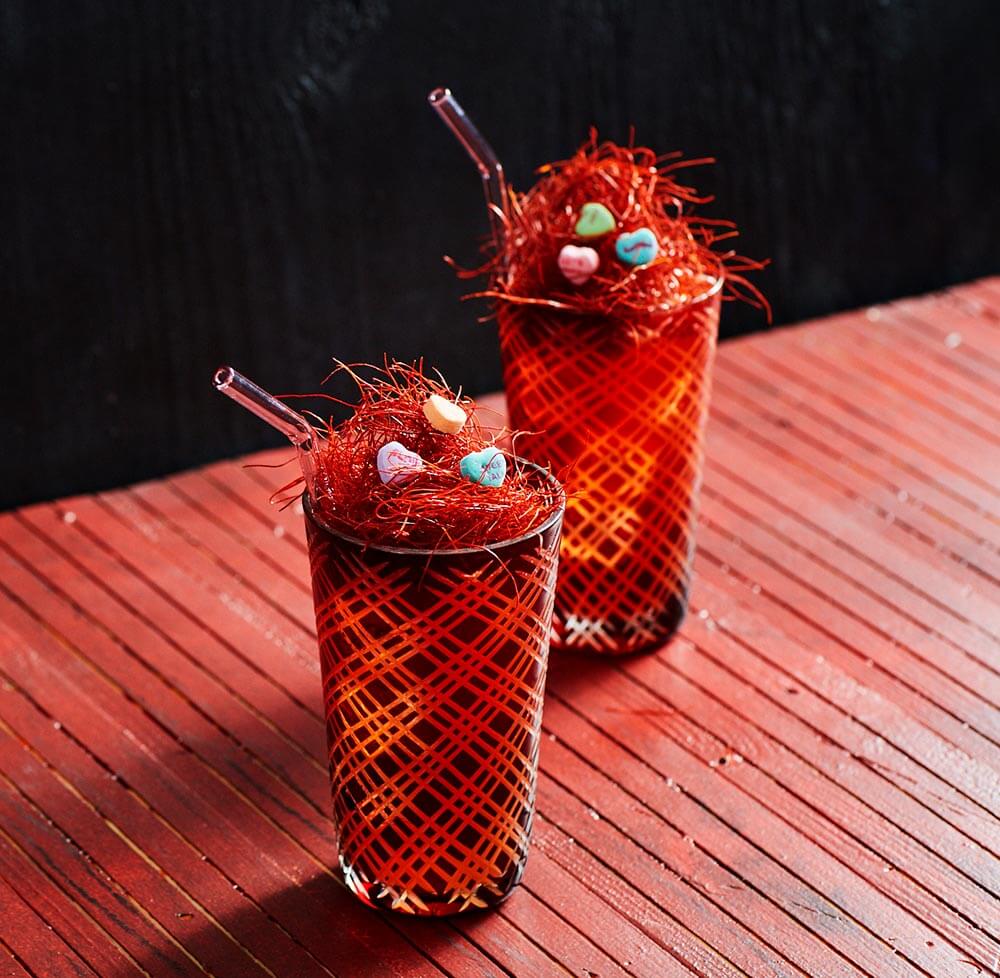 The Love Nest cocktails on red table