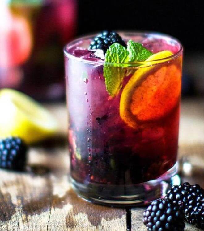 The Starling, cocktail with berry and citrus garnish