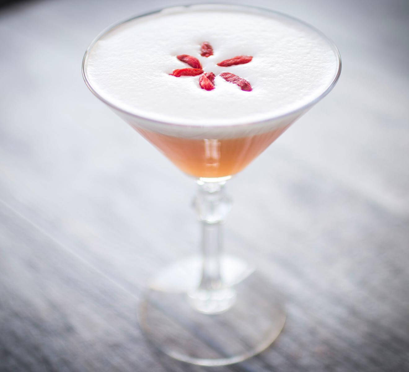 The Superfood Sour cocktail on marble table