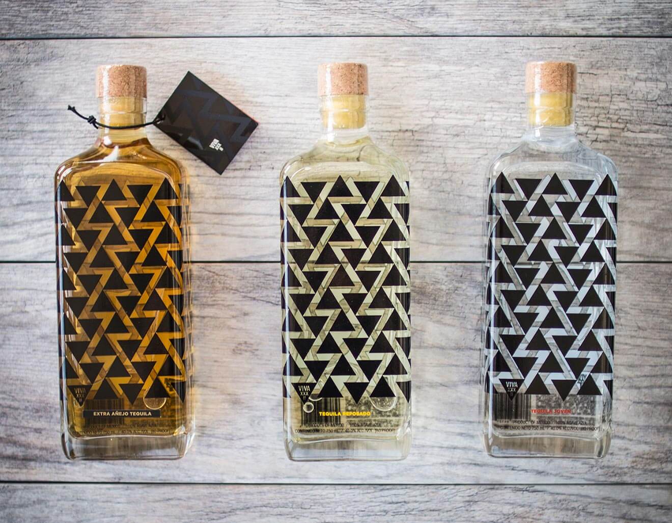 VIVA XXXII Tequila bottles on wooden table
