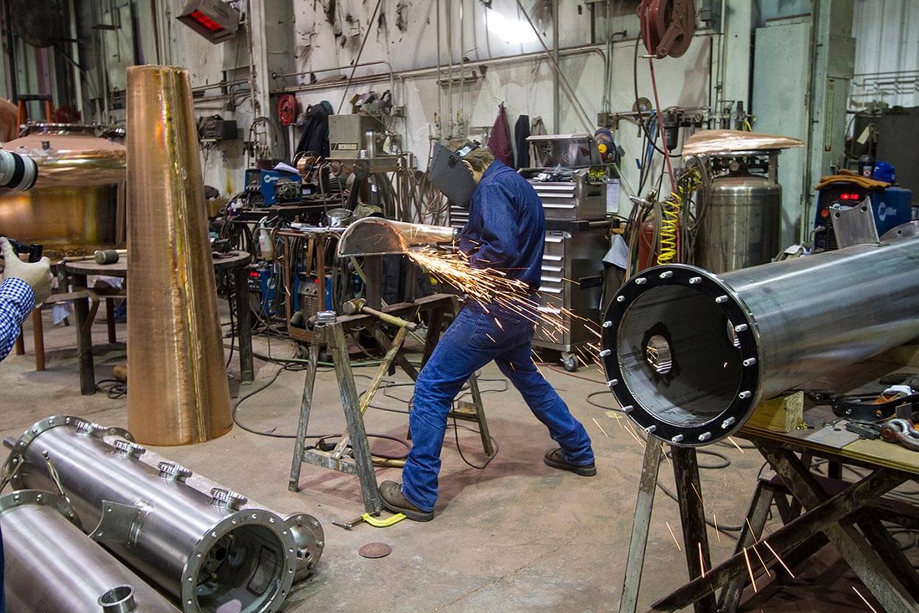 Vendome Worker Working on Potstills