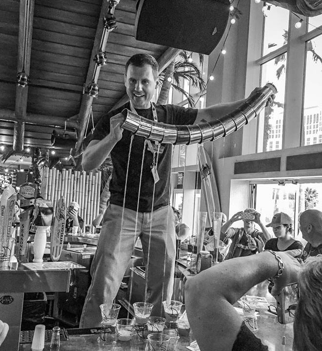 Chilled 100 Mixologist, Vladymyr Buryanov pouring several cocktails at once, chilled 100, what's chilling right now