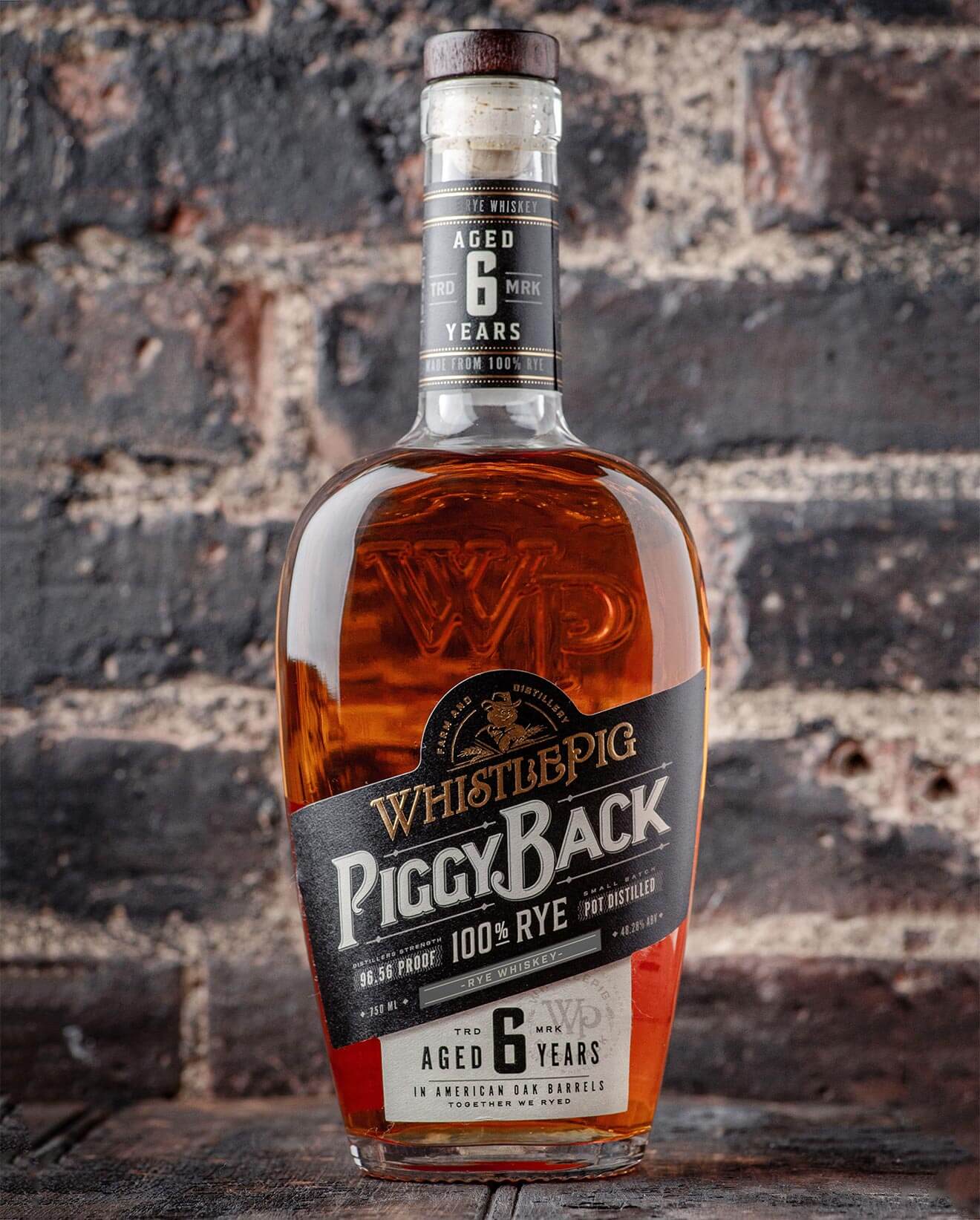 WhistlePig PiggyBack Rye Whiskey, brick background