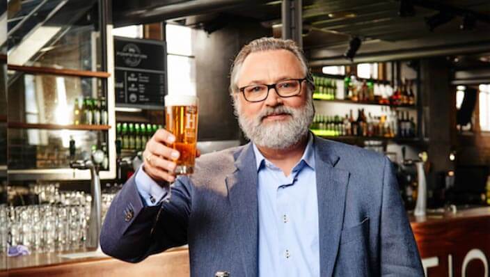 Willem van Waesberghe raising a pint