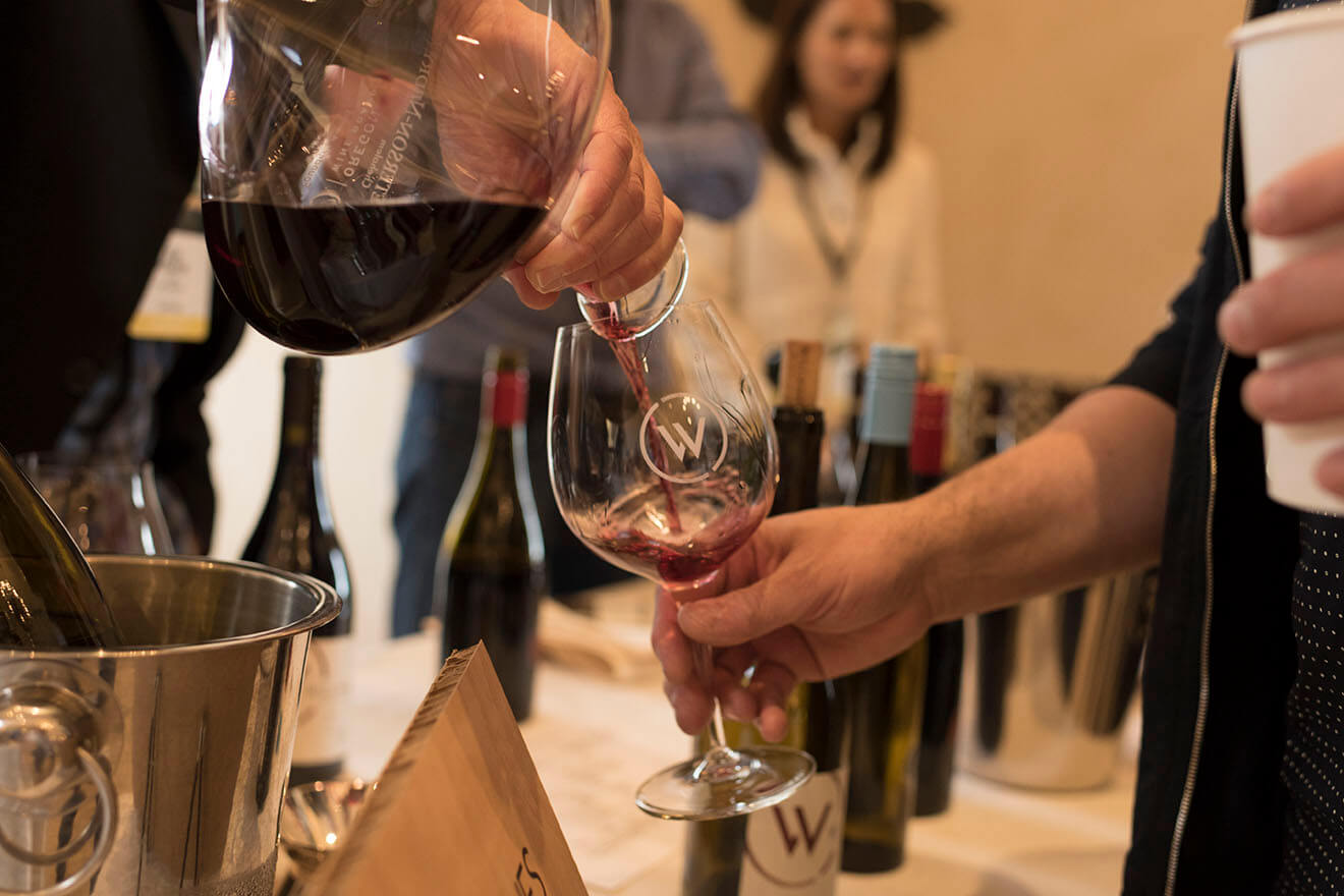 Wine is Poured at Pre-Auction Tasting at Domaine Serene