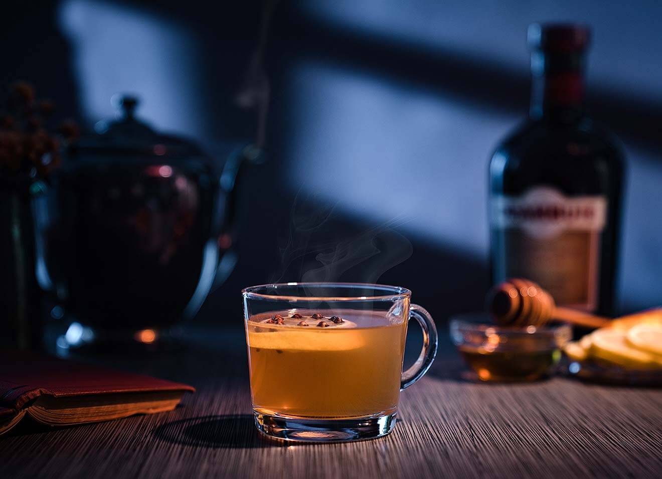 Winter Hill Punch, bottle and glass on dark background