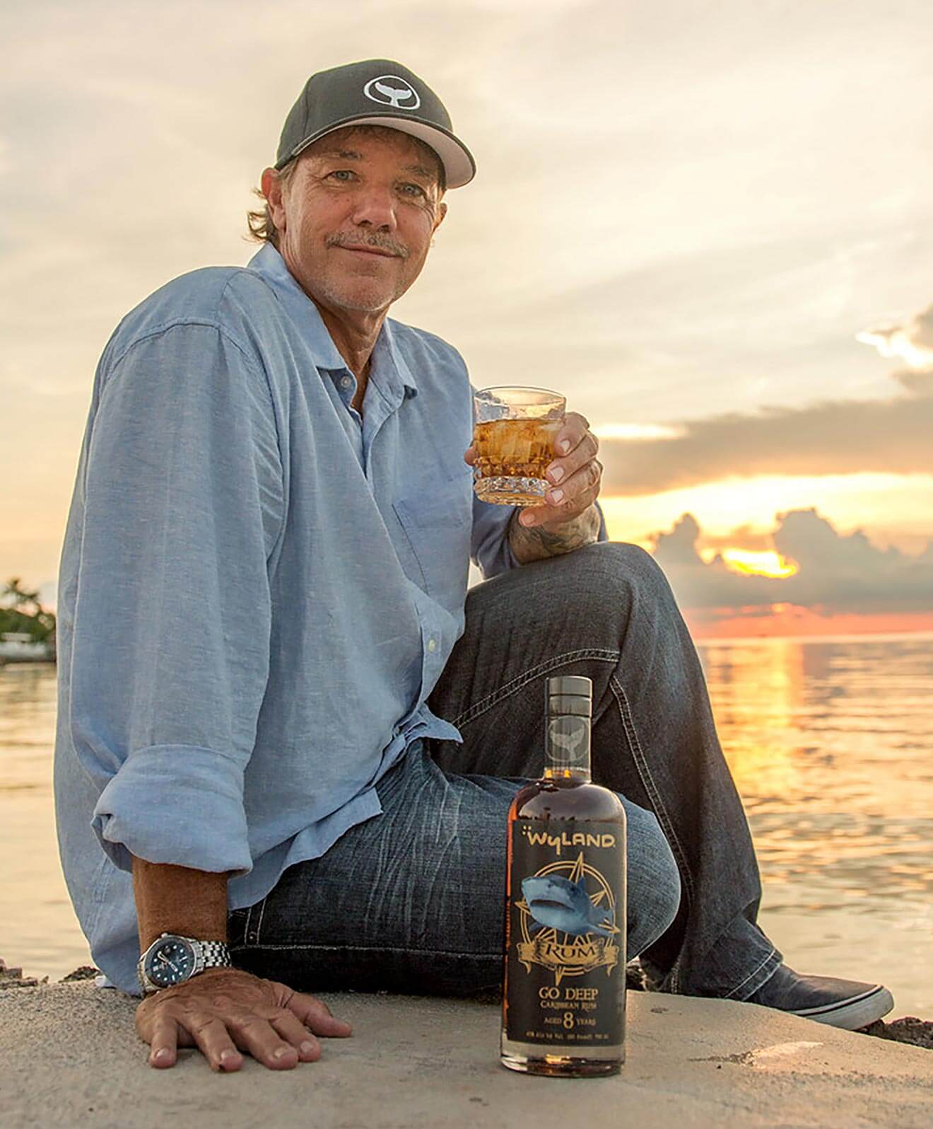 wyland and his new rum, beach and sunset
