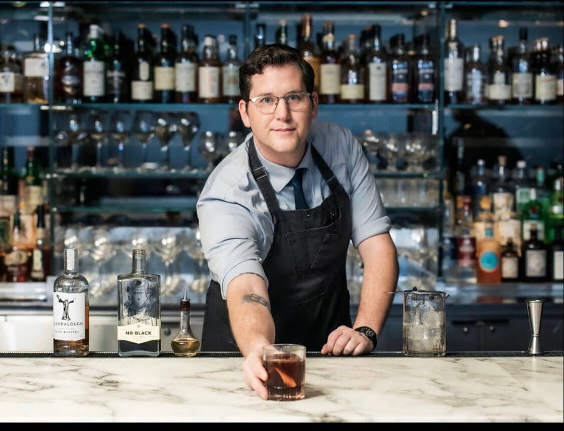 Zev Glesta - Chilled 100 Member, NY, serving up a cocktail behind the bar