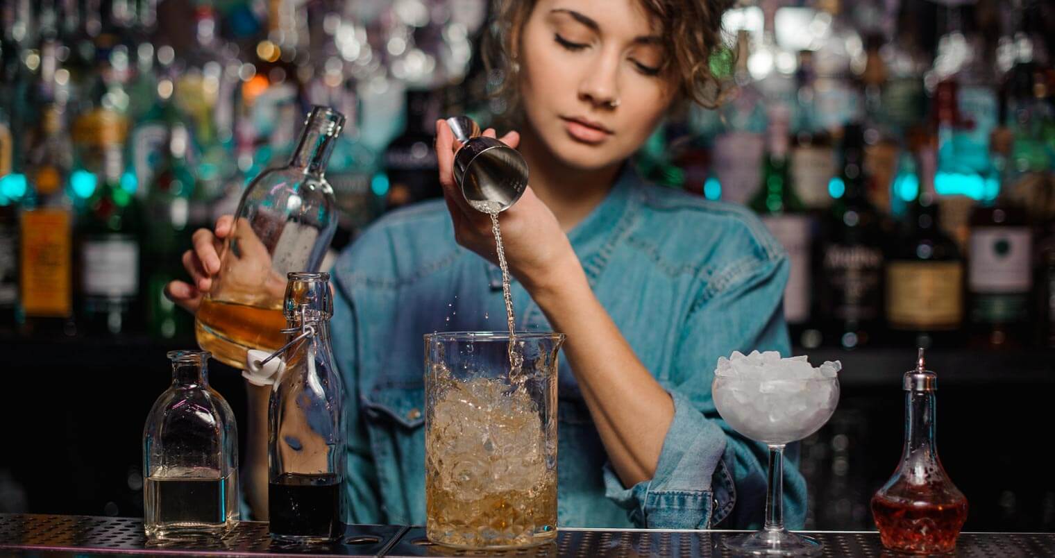 mixologist creating a cocktail, featured image