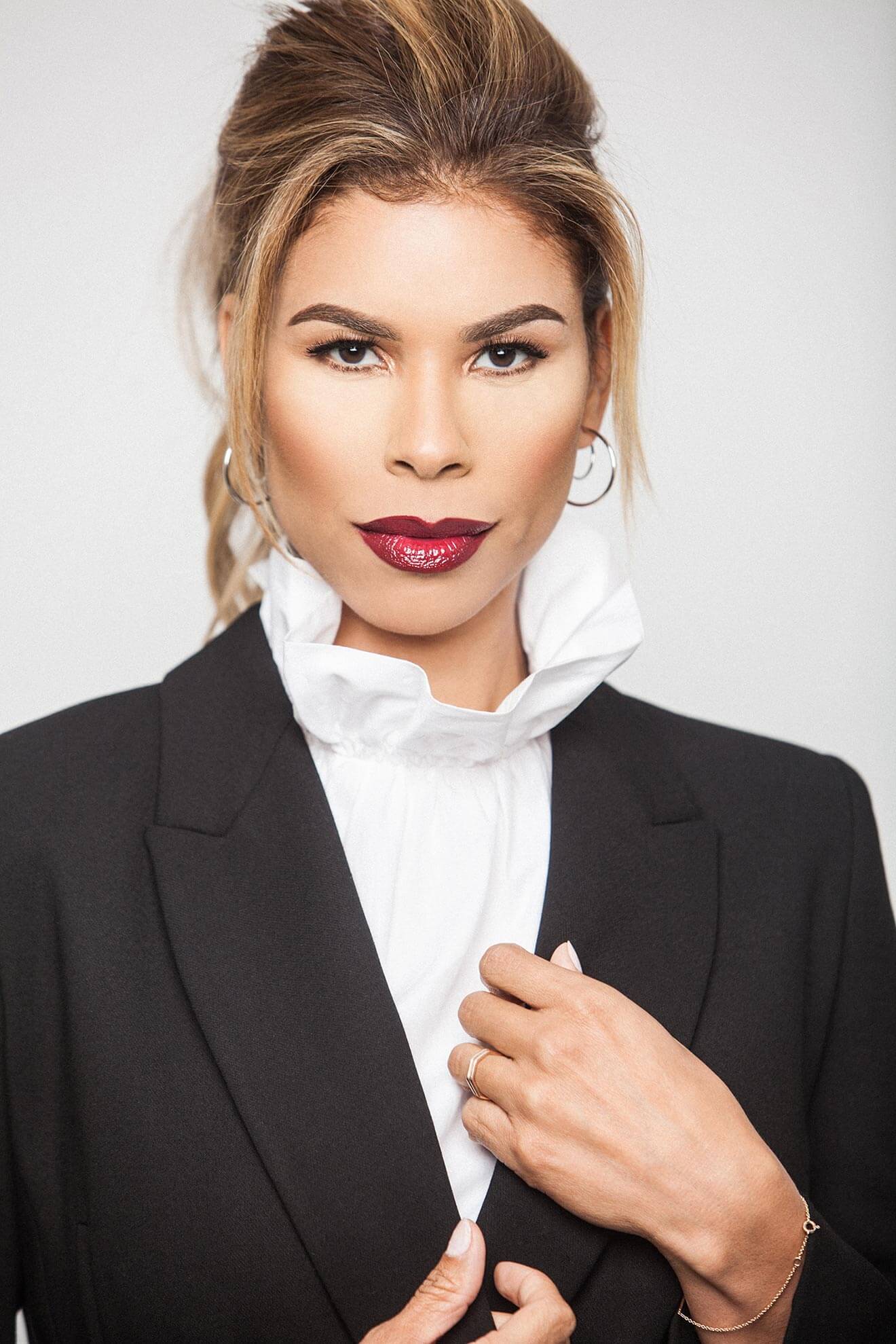 Chillin’ with Gwendolyn Osborne-Smith, black suit on white