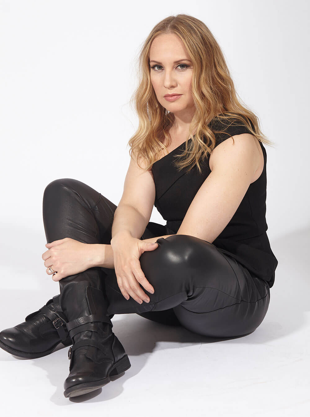 Chillin’ with Kelly Karbacz, all black tank and leather pants, sitting