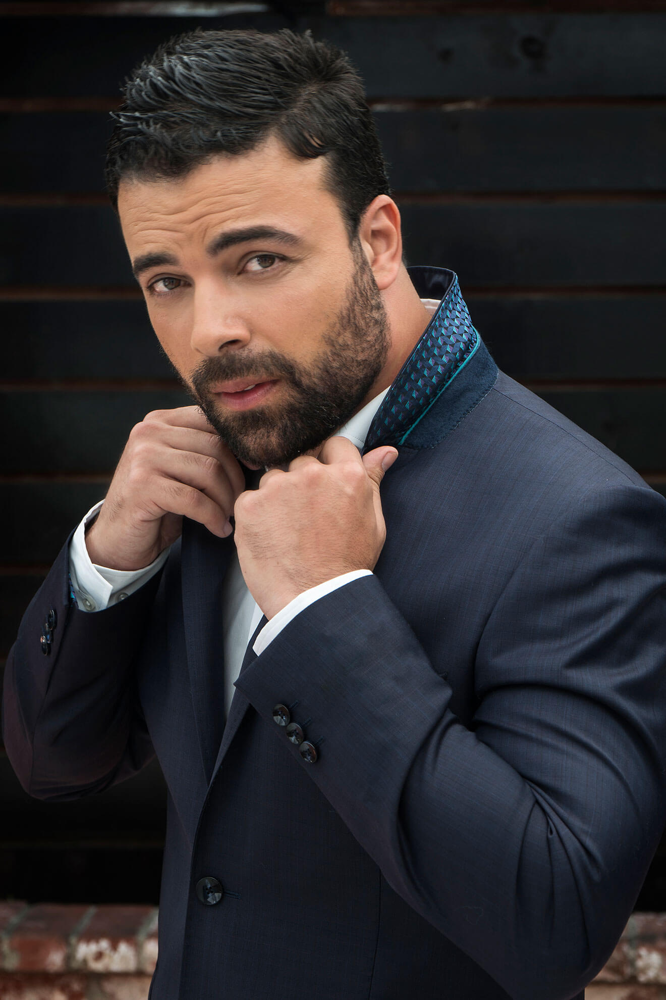 Chillin' with James Martinez, popping collar in dark suit