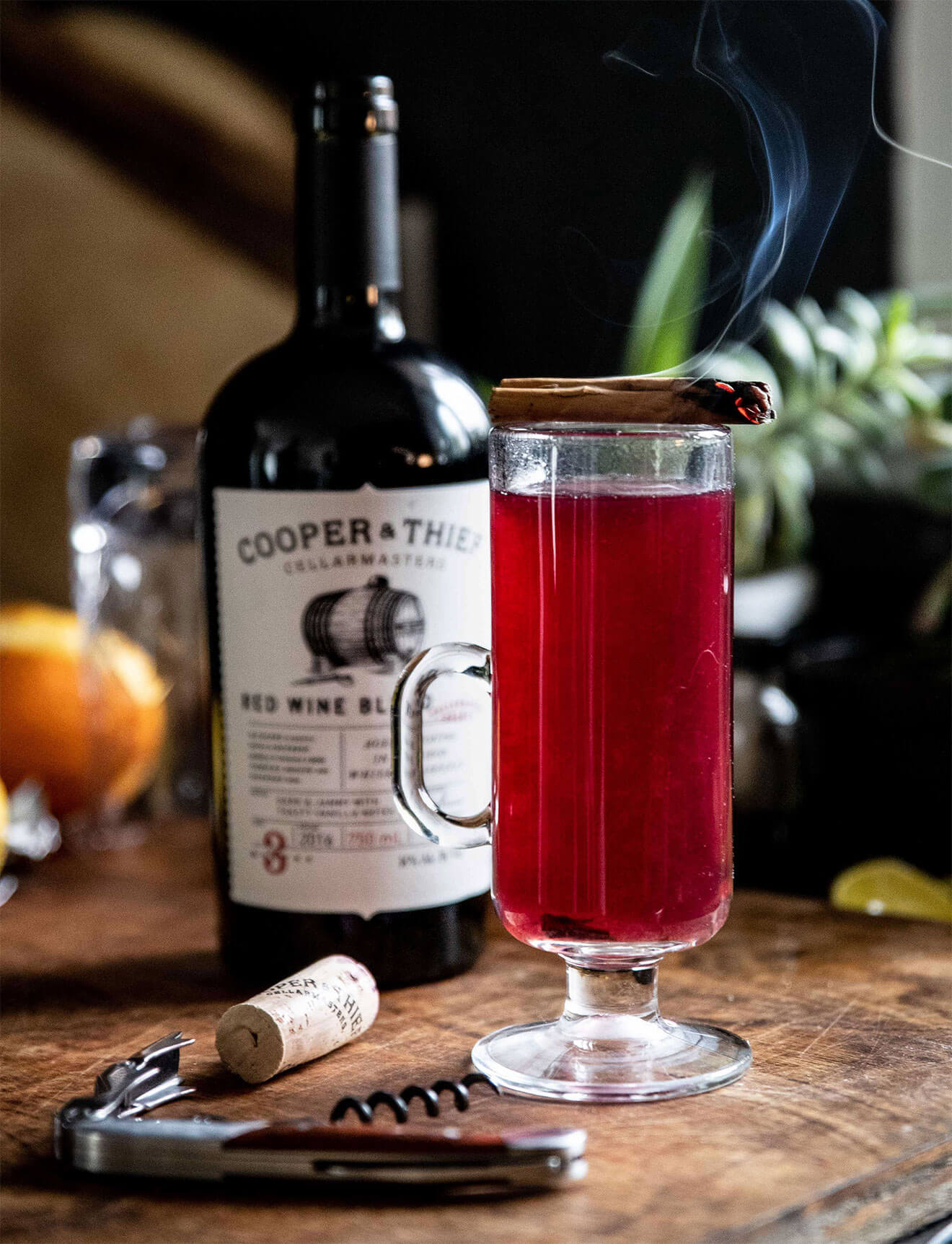 The Cooper & Thief Hot Toddy, bottle and cocktail with garnish