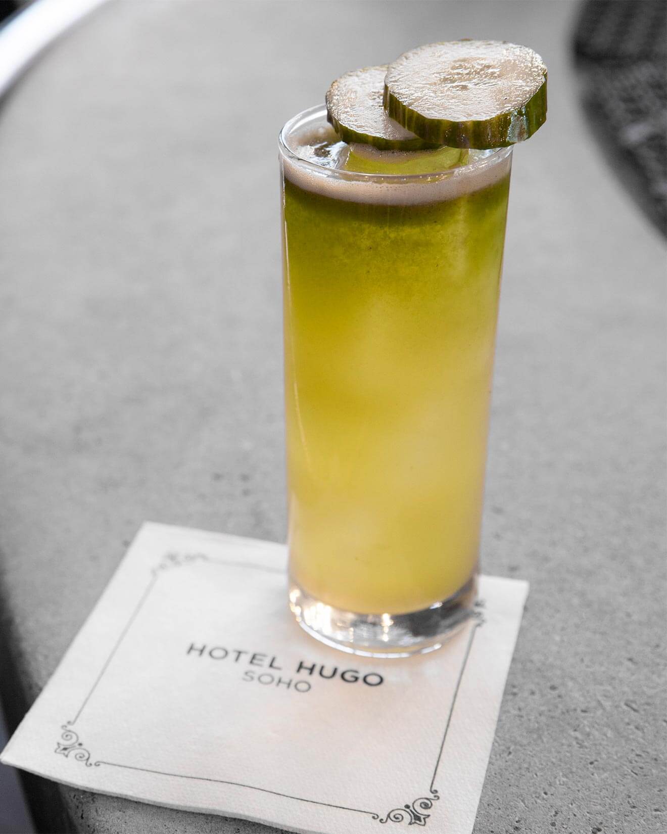Cucumber Quencher, cocktail on cocktail napkin