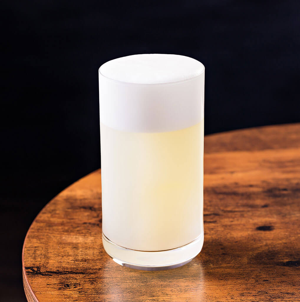 Ramos Gin Fizz, cocktail on wooden table